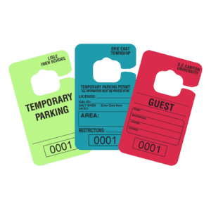 group of three temporary paper parking permits printed on Astrobright paper